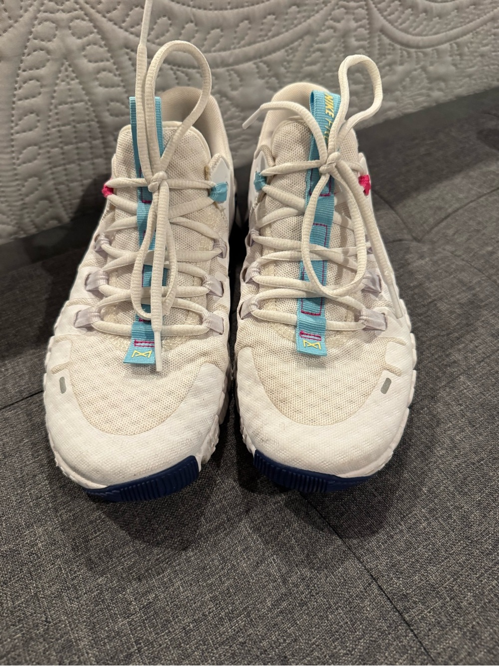 Nike White Running Shoes with Blue and Pink Accents